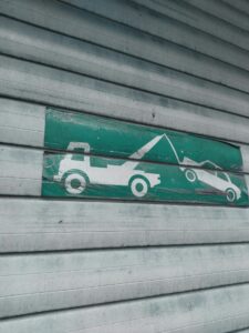 tow truck icon painted on a wall, seen before you scrap your car.